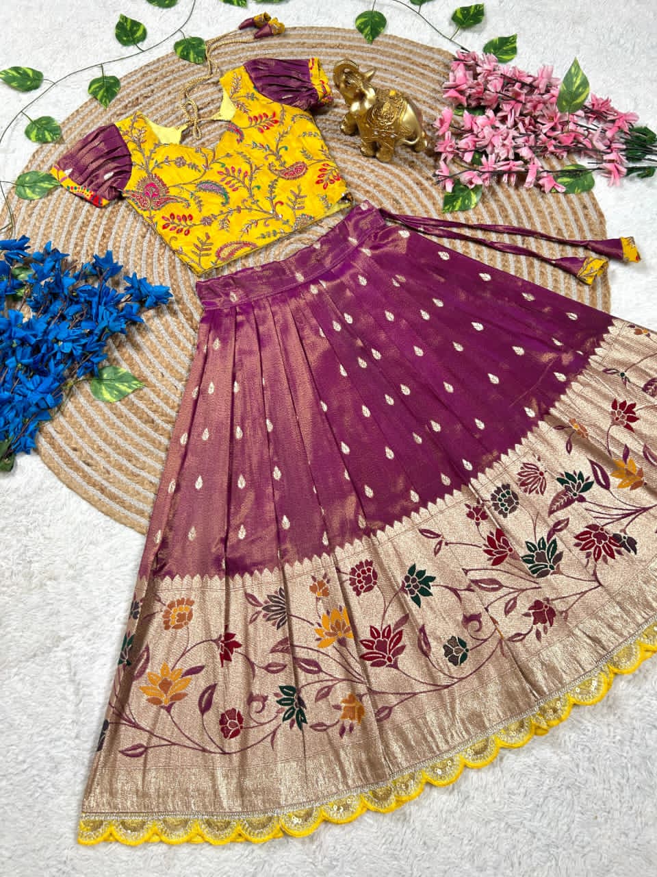 Beautiful Flower Position Work blouse paired with Golden zari Pure Tissue skirt