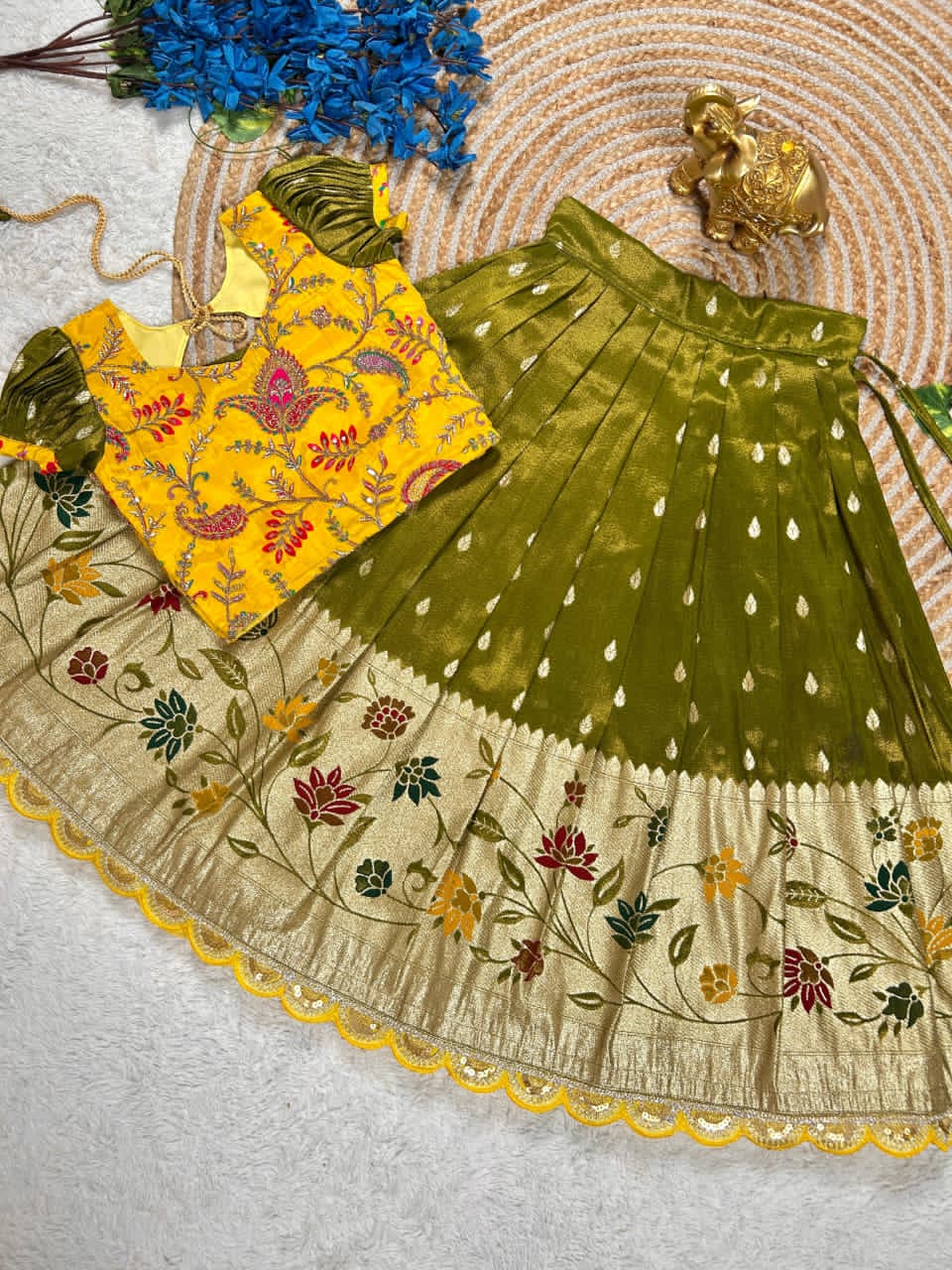 Beautiful Flower Position Work blouse paired with Golden zari Pure Tissue skirt