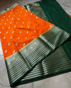 Bright orange body with a dark green